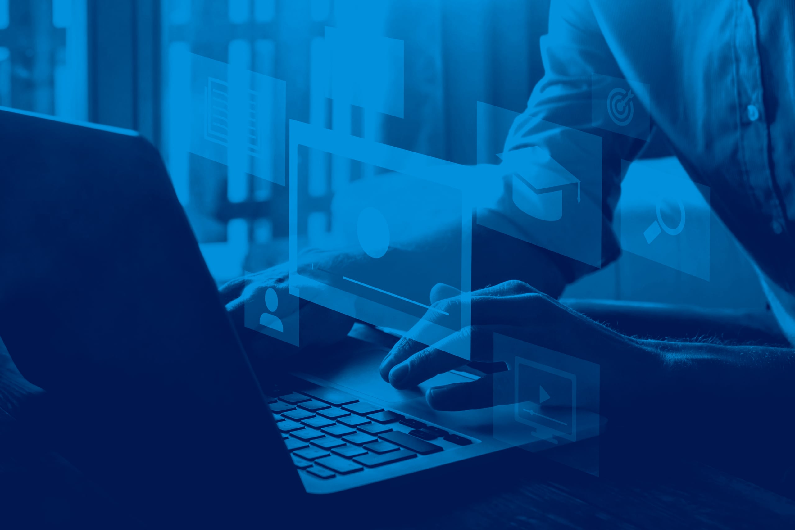 A person types on a laptop with digital interface icons, such as user, search, and mail symbols, overlaid in blue tones, suggesting technology or digital communication—perfect for engaging in a Webinar Series on VTE or similar topics.